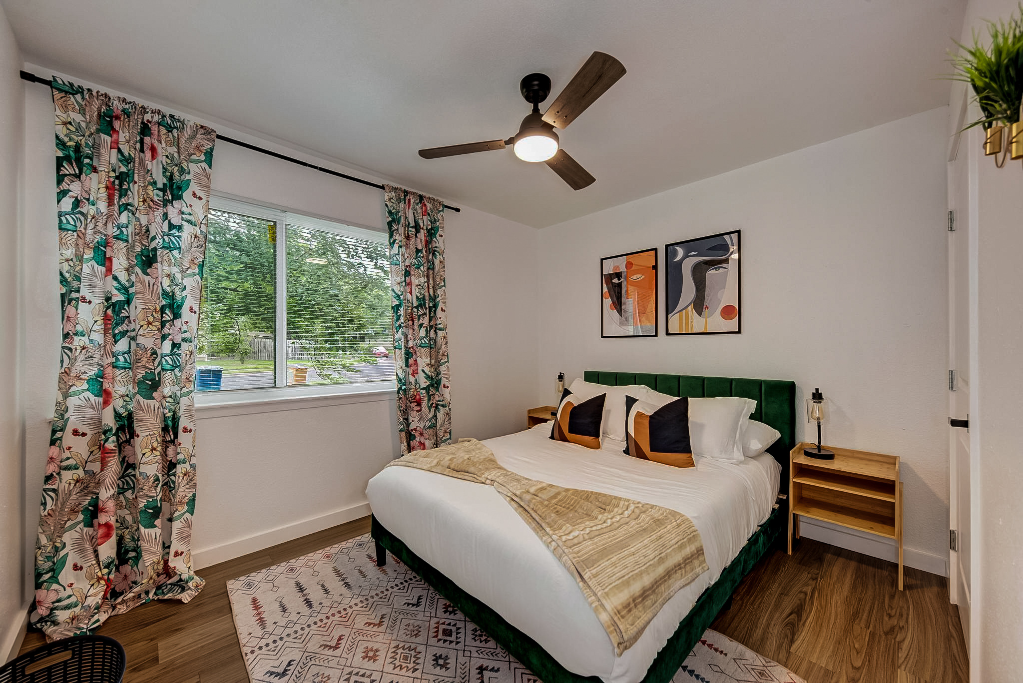 Serene master bedroom with layered linen bedding and soft ambient light