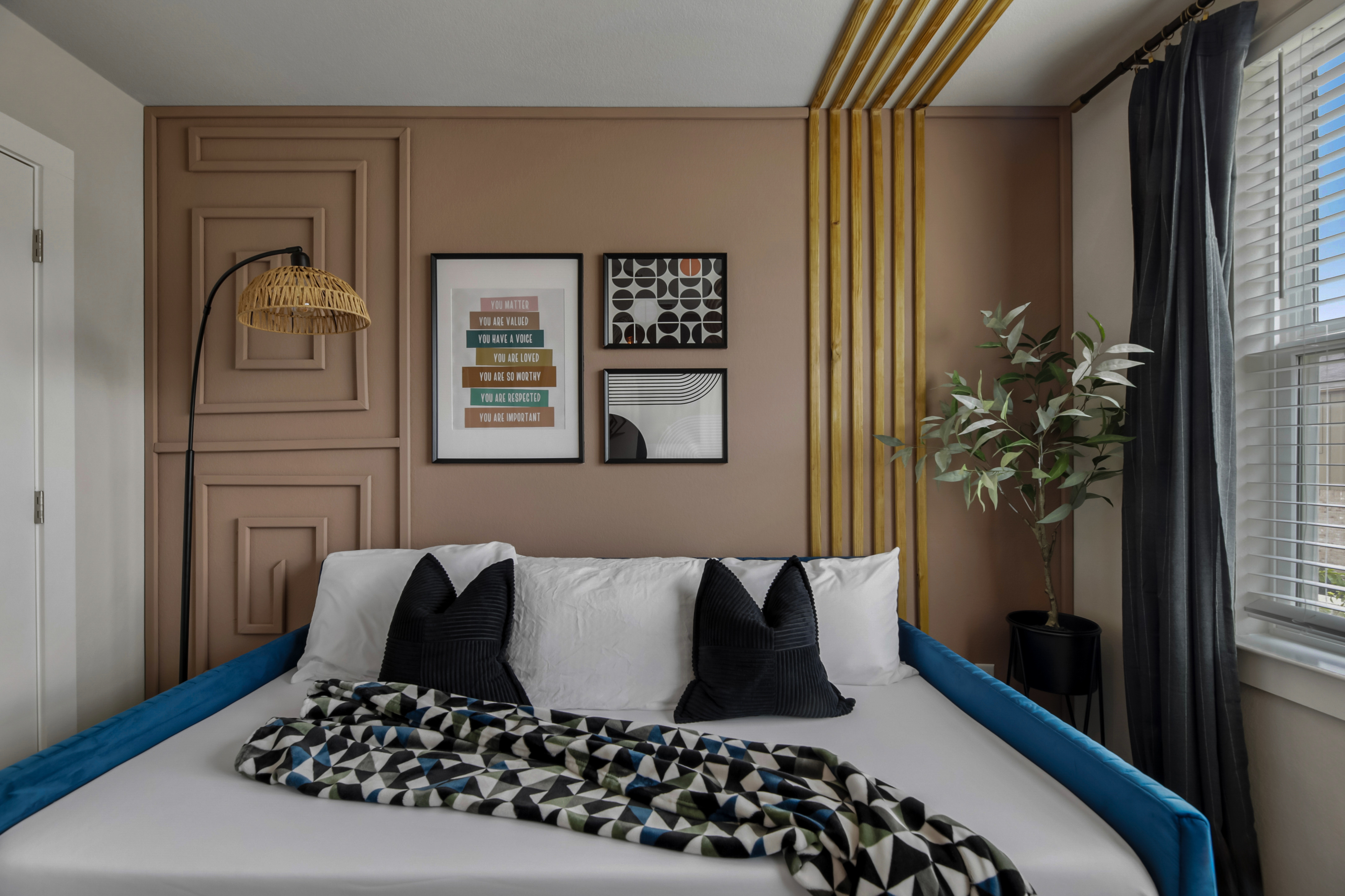 Bedroom corner with reading chair, lamp, and curated accessories
