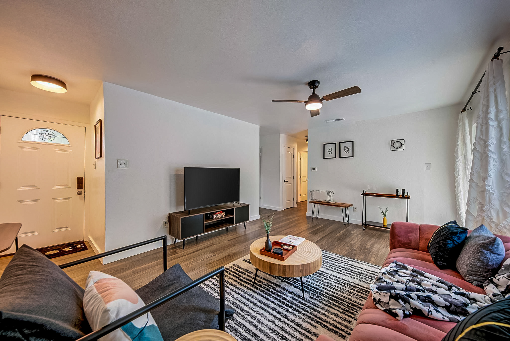 Refined living room with statement furniture and layered lighting